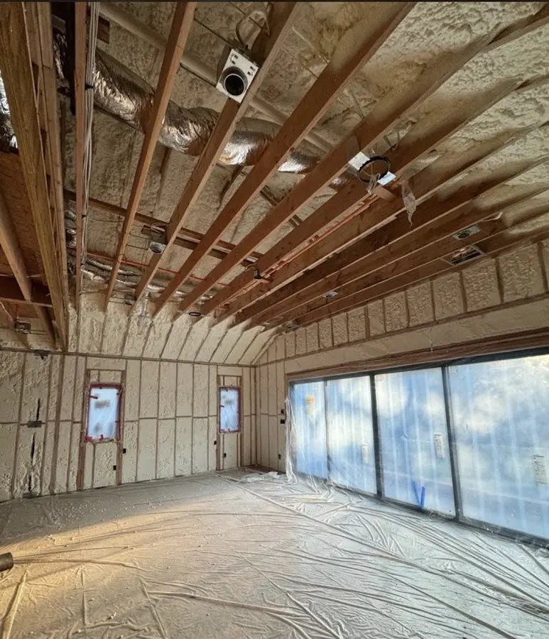 Interior walls and ceiling insulated with spray foam during new construction in Dennis